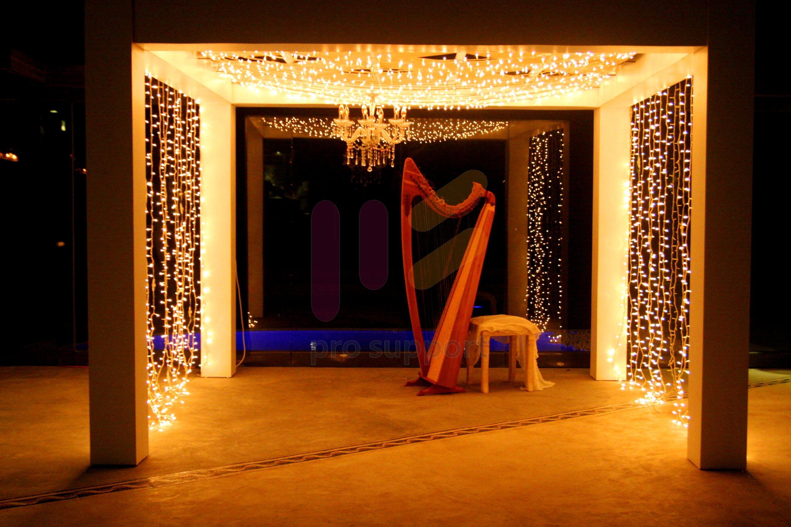 Fairy lights on a gazebo for a wedding in Santorini by pro-support Co